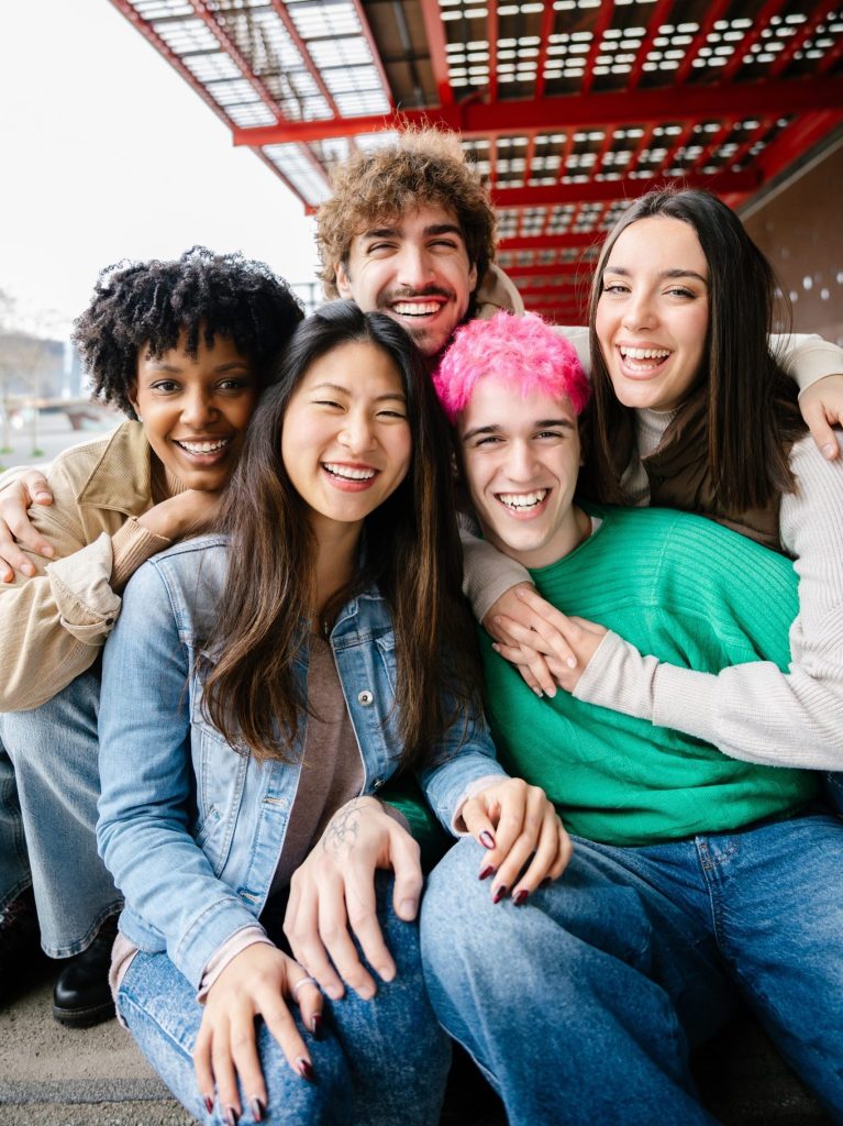 Vertical,Photo,Of,Diverse,Group,Of,Happy,Young,Students,Sitting